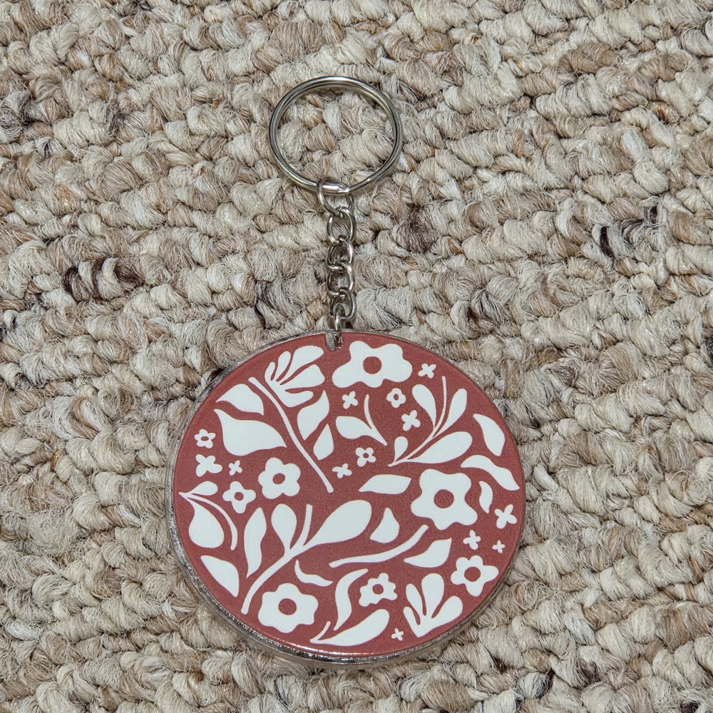 Floral Keychain with Brown and White Design
